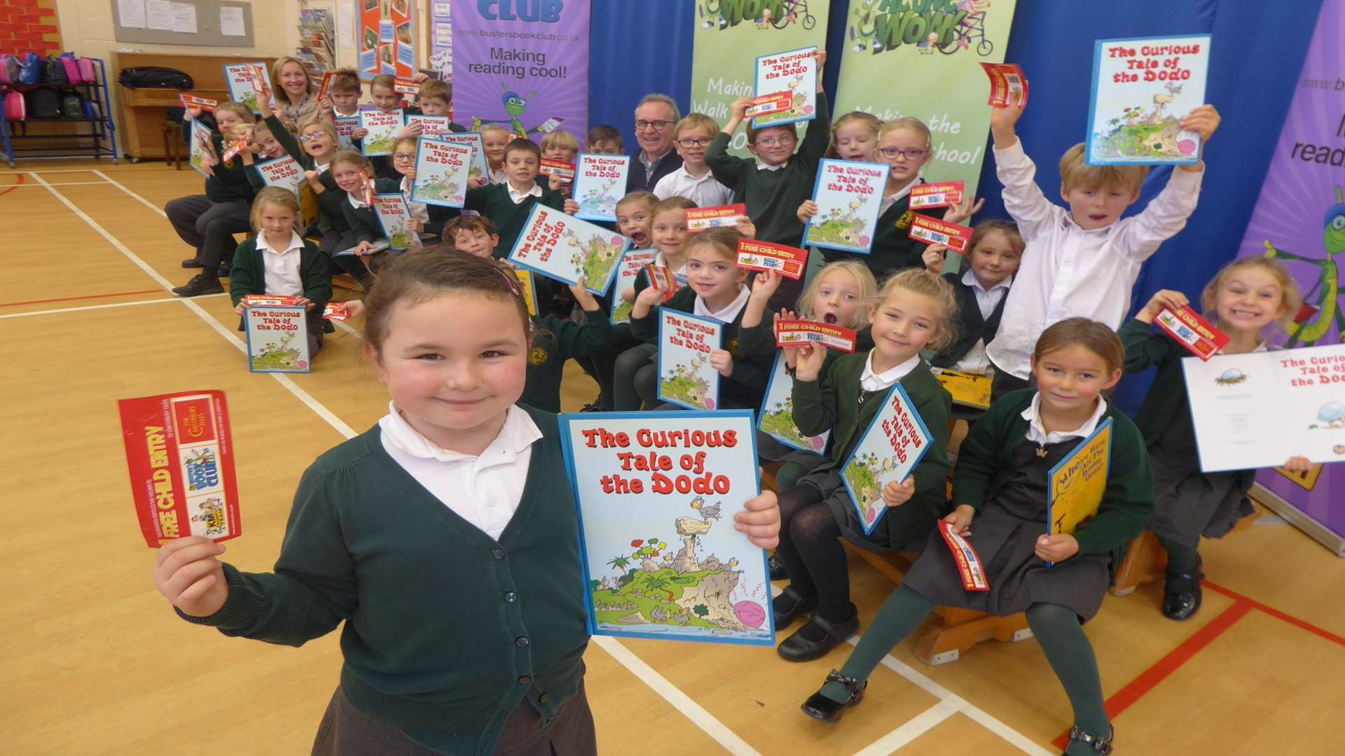 Whitstable author Anthony Cooper reads his book The Curious Tale of the Dodo to the winners of a walk to school contest: Hernhill C of E Primary School in Faversham. Front: Bella Jones, 6, with Year 2 Class.