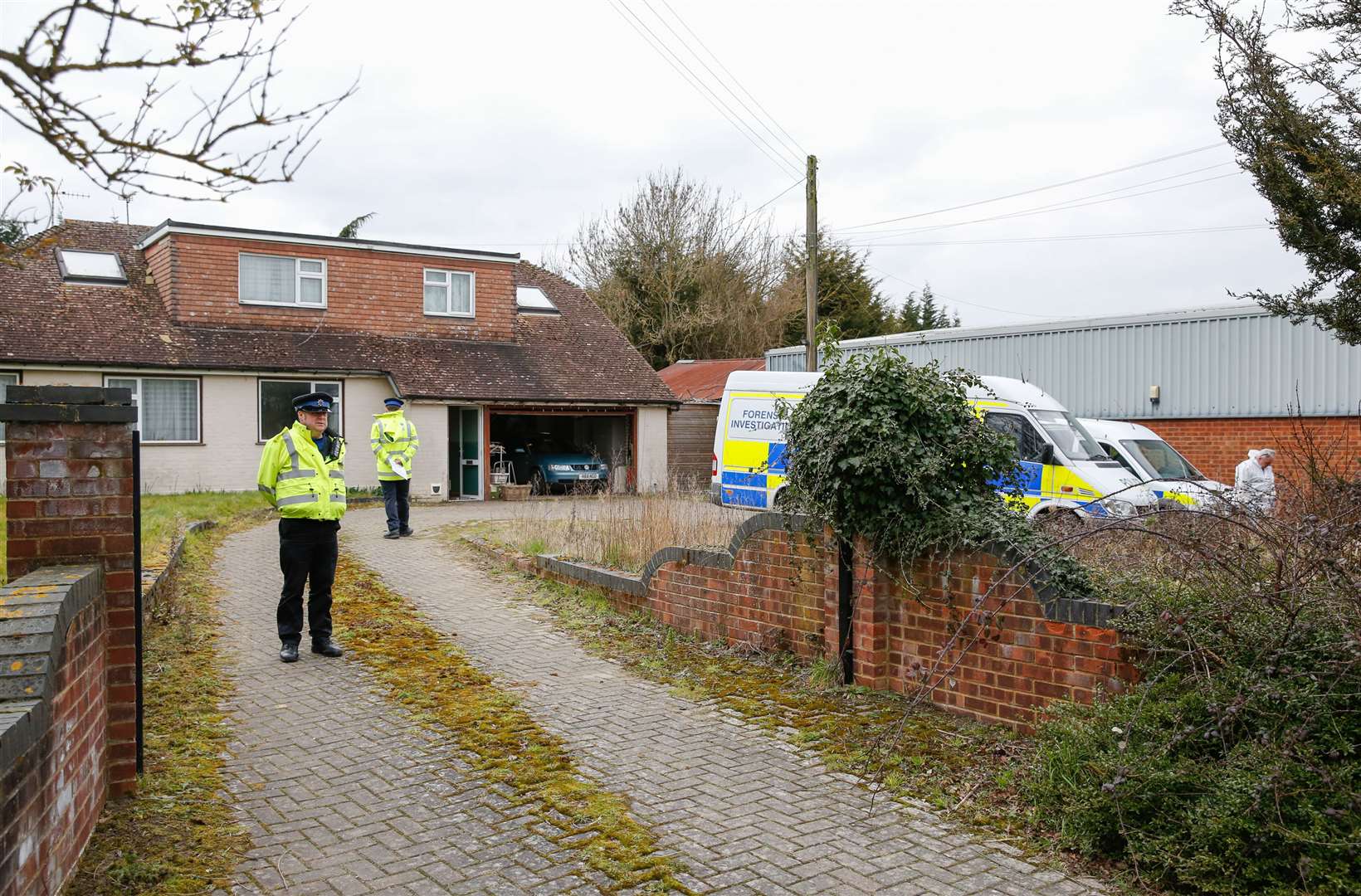 Police at the bungalow where Roy Blackman was killed. Picture: Matthew Walker