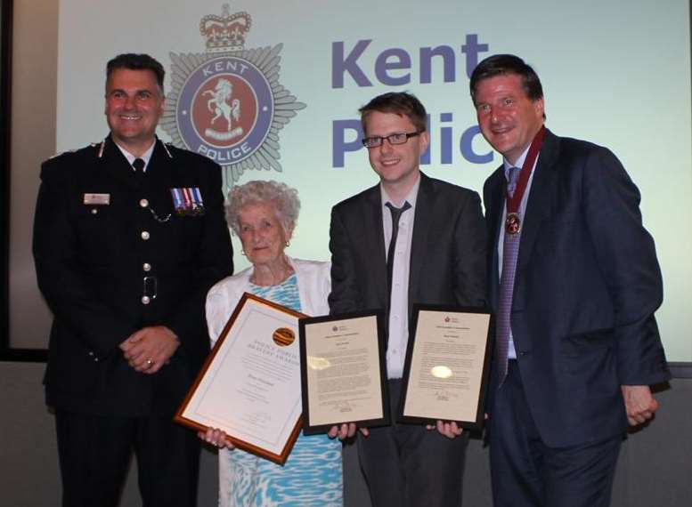 Rose Overland and her grandson Gary Yearley are presented with their bravery awards and merits by the Chief Constable of Kent Alan Pughsley and the High Sheriff of Kent Hugo Fenwick