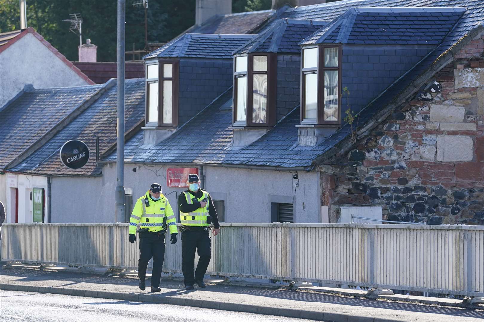 Police in New Cumnock, East Ayrshire, during the search (Andrew Milligan/PA)