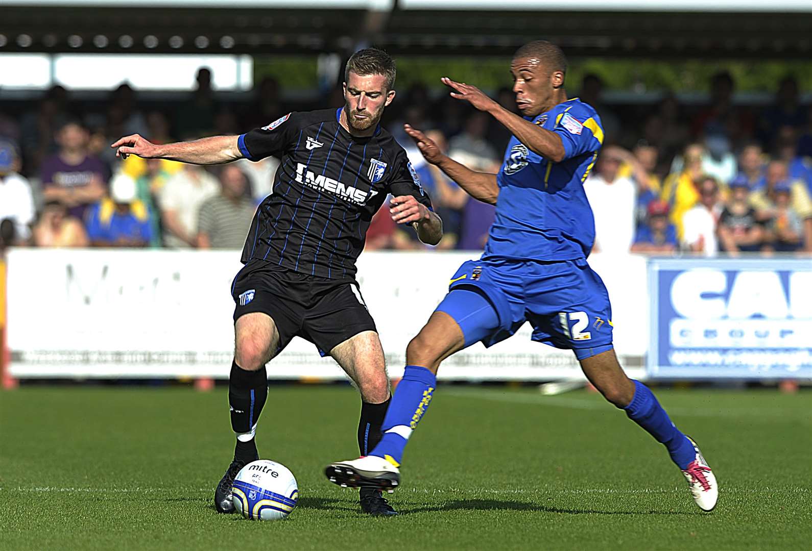 Christian Jolley in action for AFC Wimbledon against Gillingham's Matt Fish in 2011. Picture: Barry Goodwin