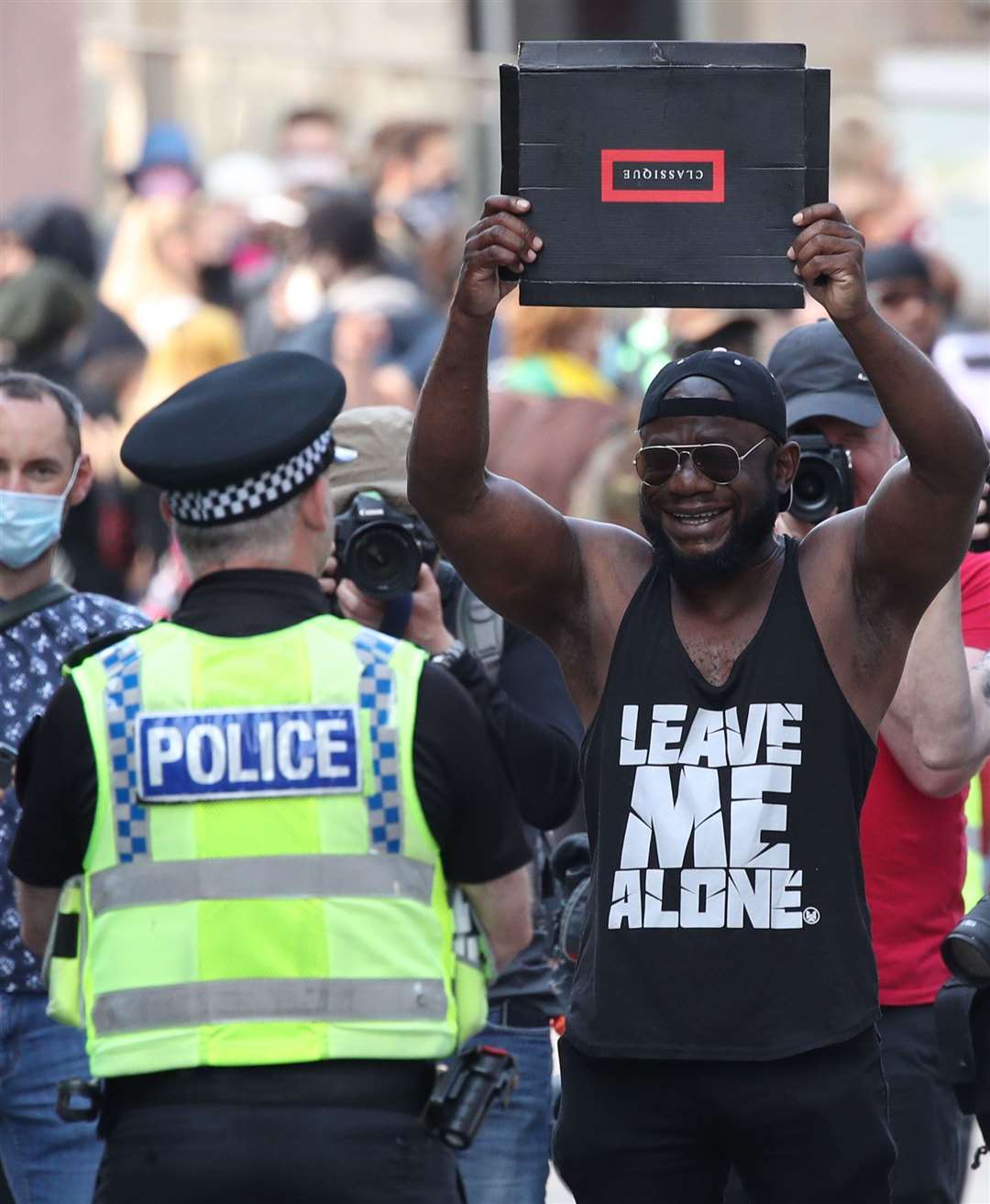 Police and a protester at a Black Lives Matter demonstration in London (Danny Lawson/PA)