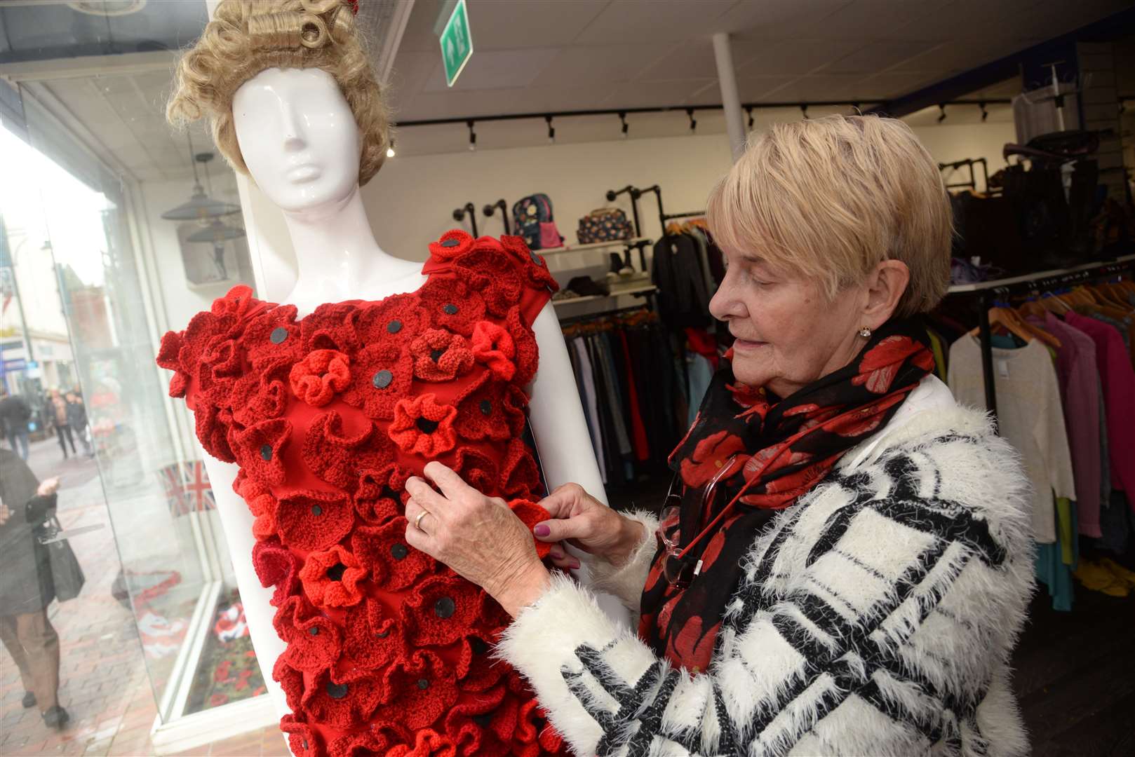 Rose Joyce at work on her Remembrance Day display in the Wisdom Hospice charity shop in Chatham