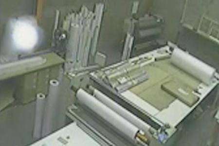 CCTV images show a mysterious white orb floating across the camera at printing company SMP Large Format