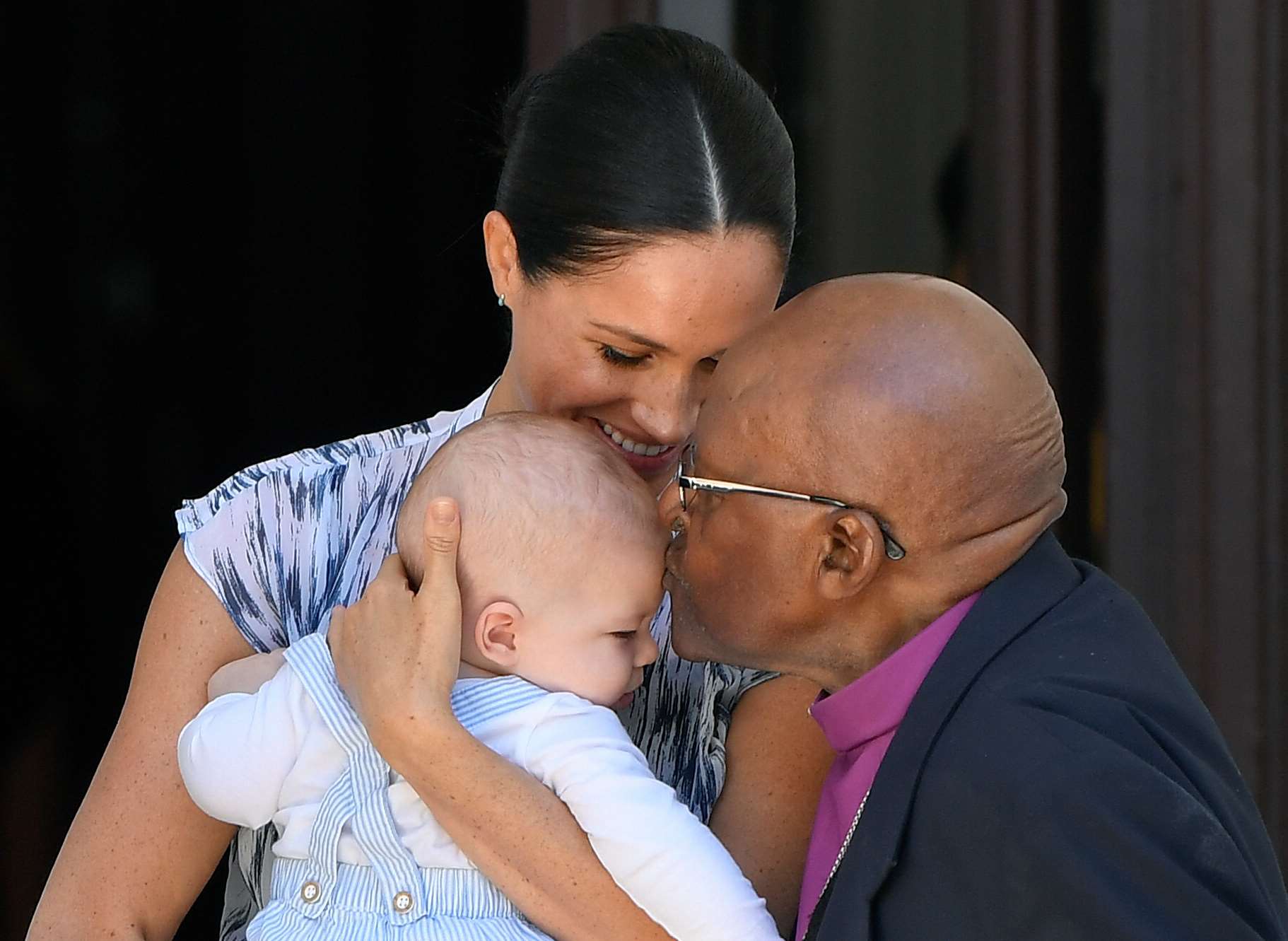 A kiss for Archie from Archbishop Desmond Tutu (Toby Melville/PA)