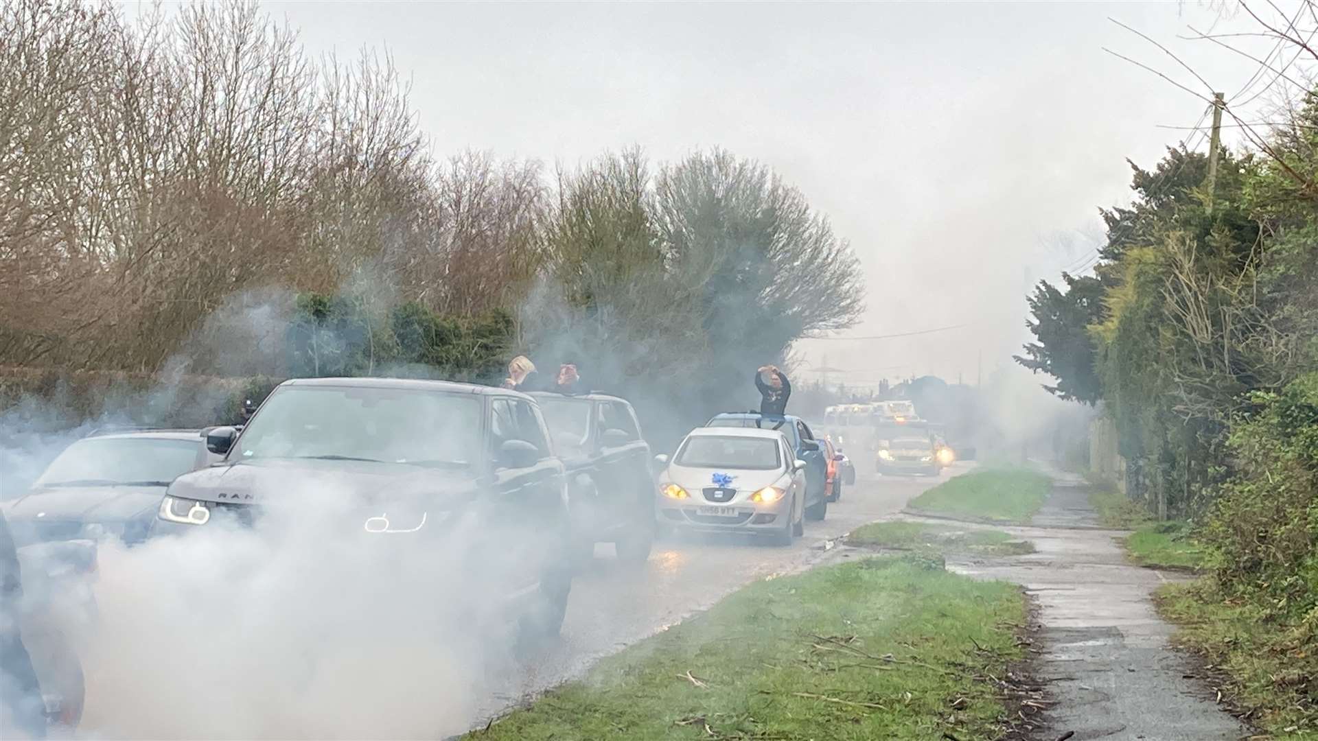 Smoke from burning tyres covered the carriageway outside the Garden of England crematorium at Bobbing for the funeral of car-mad Frankie Wright