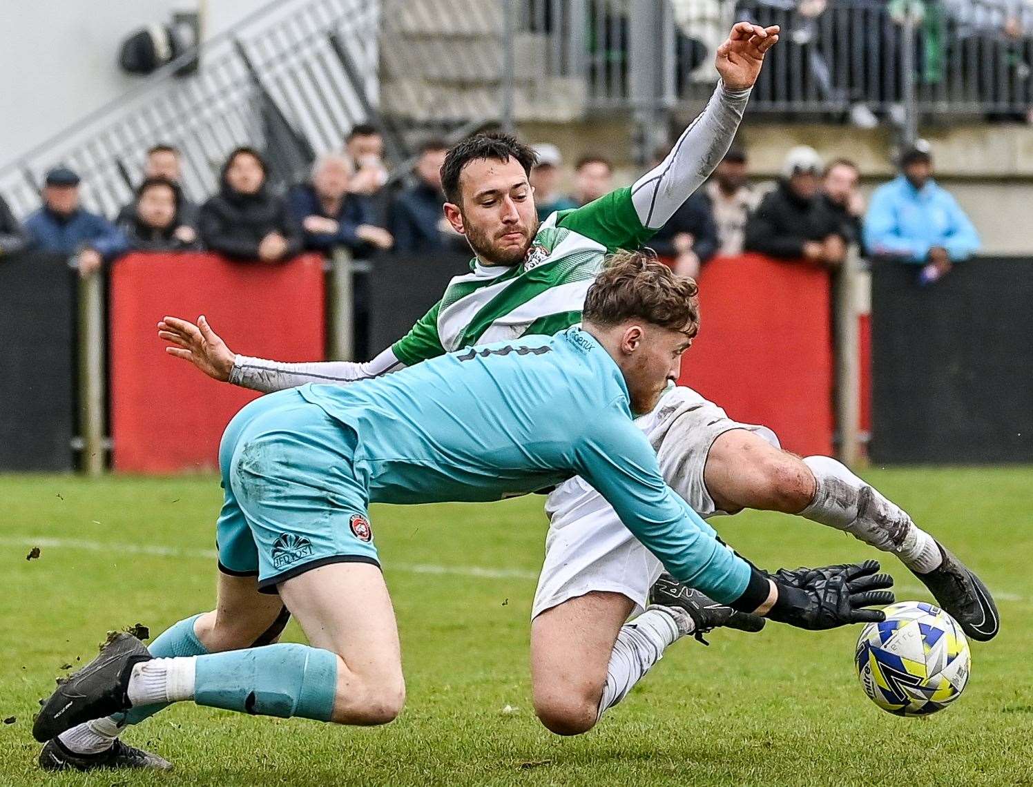 Erith goalkeeper Mackenzie Foley saves at the feet of Corinthian's Charlie Clover. Picture: Dave Budden