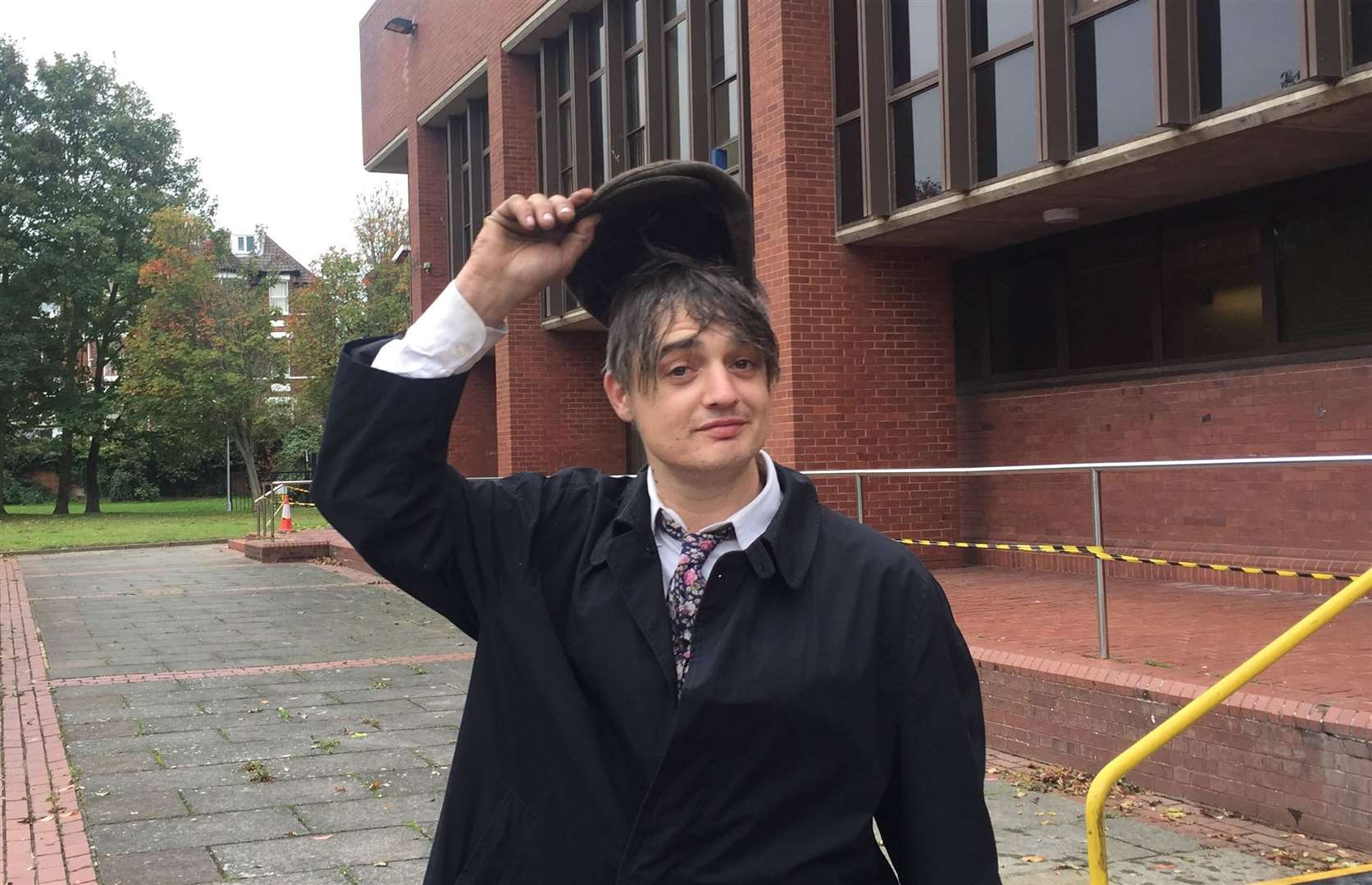 Pete Doherty doffed his hat outside court after being banned from driving