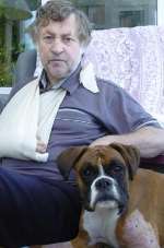 MAULED: Michael Ball and his Boxer puppy Ruby. Picture: ANDY PAYTON