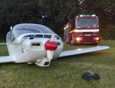 The two-seater light aircraft which made an emergency landing on an airstrip at Lodge Lees, Denton, on Monday evening. Picture: Kent Fire & Rescue Service