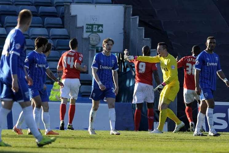 Stuart Nelson berates his defenders as Gillingham concede Picture: Barry Goodwin