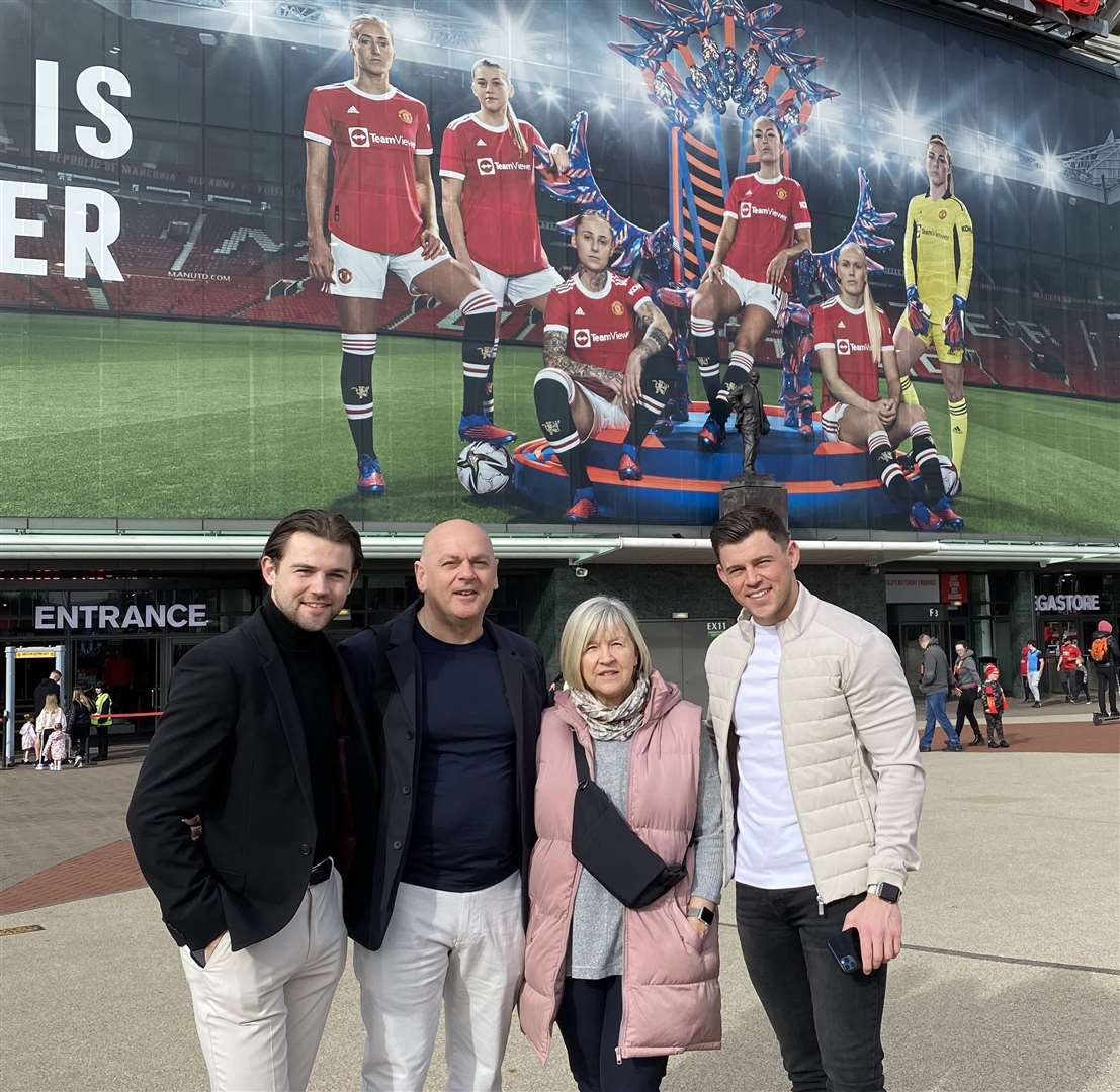 Alessia's family, including brothers Luca, left, and Giorgio, right, and parents Mario and Carol outside a picture of her at Old Trafford