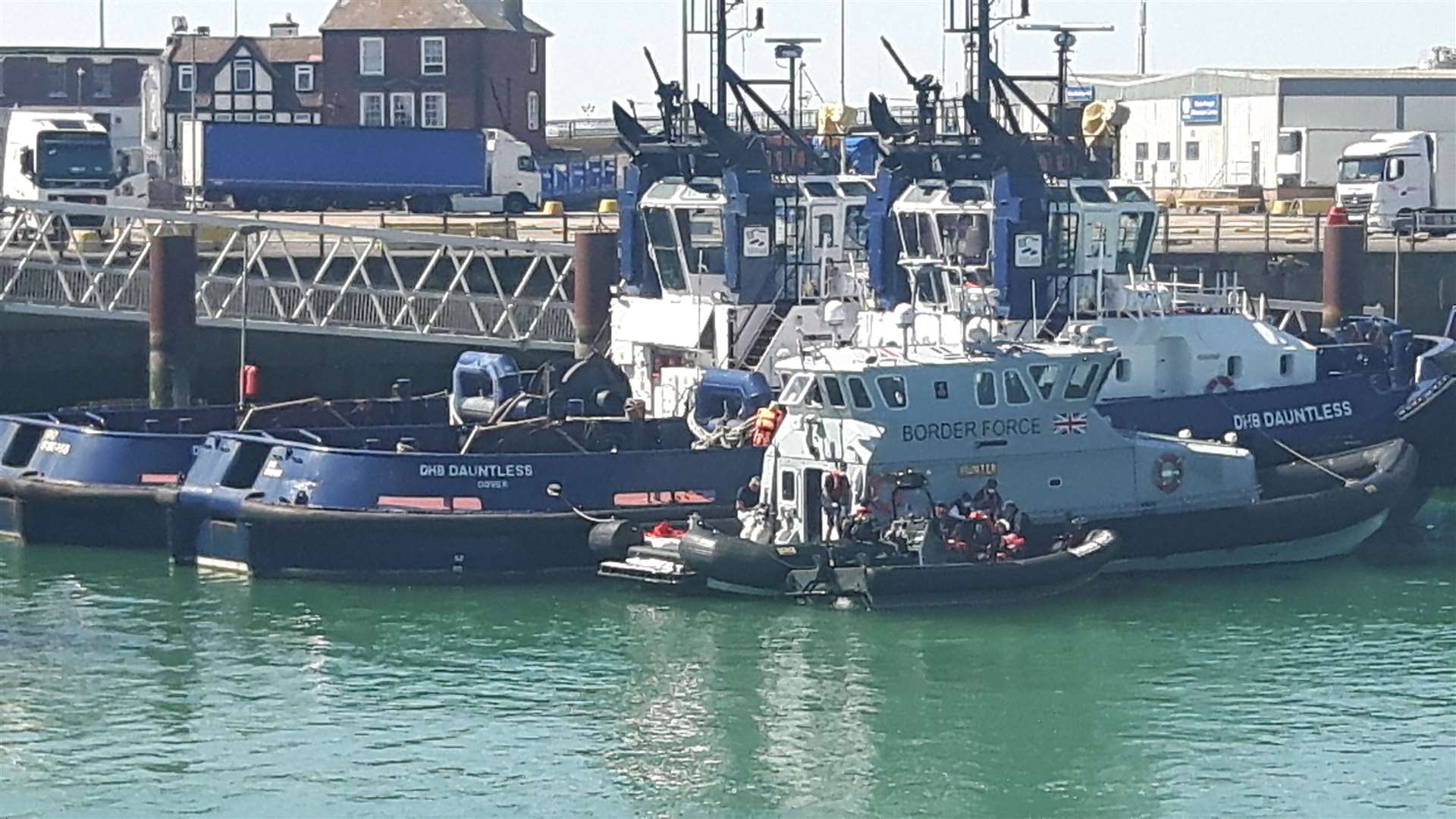 The women and children were at the front of the RHIB - one child was seen clapping as the boat came in to berth