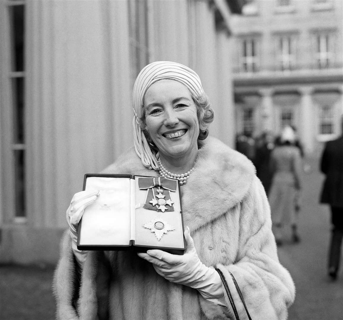 Being invested a Dame Commander of the British Empire at Buckingham Palace in 1975 (PA)