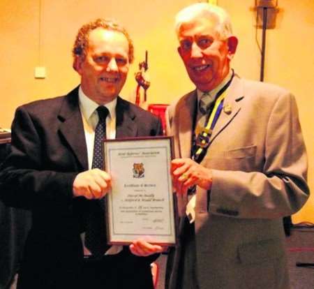 Dave Mcannally (left) receives his 15 year service award from Kent Referees' Association president John Fenning