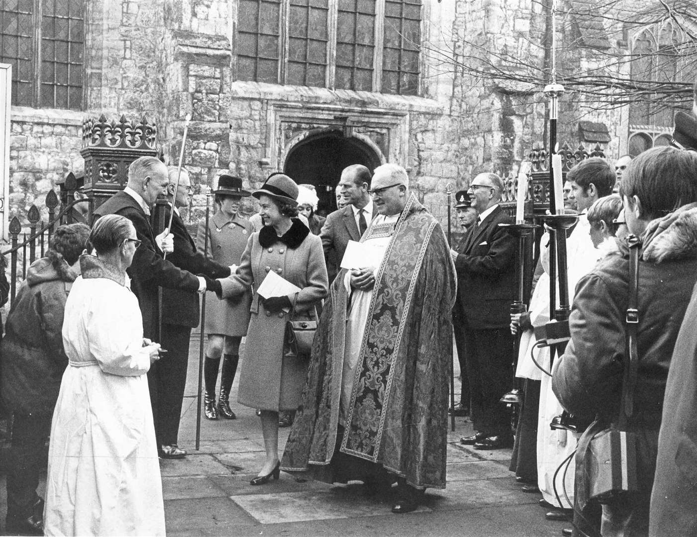In 1970, Queen Elizabeth II with the Duke of Edinburgh, Prince Andrew and Princess Anne, escorted by Canon Neville Sharp, were introduced to churchwarden Percy Woods and other church officials after the celebrations to mark the 500th anniversary of the re-building of Ashford Parish Church