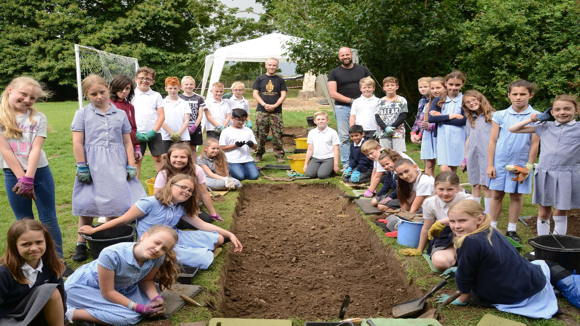 Year 5 pupils at Cobham Primary School taking part in the dig. Picture: Gary Browne