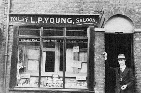 The hairdressing business, with father Leslie Percy in doorway