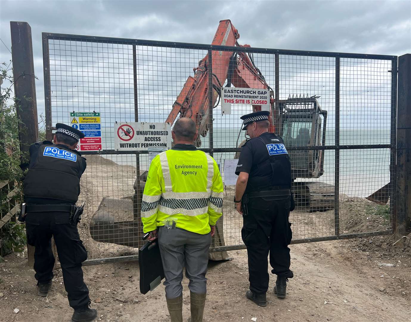 Police and Environmental Agency officers at Eastchurch Gap in June. Picture: Megan Carr.