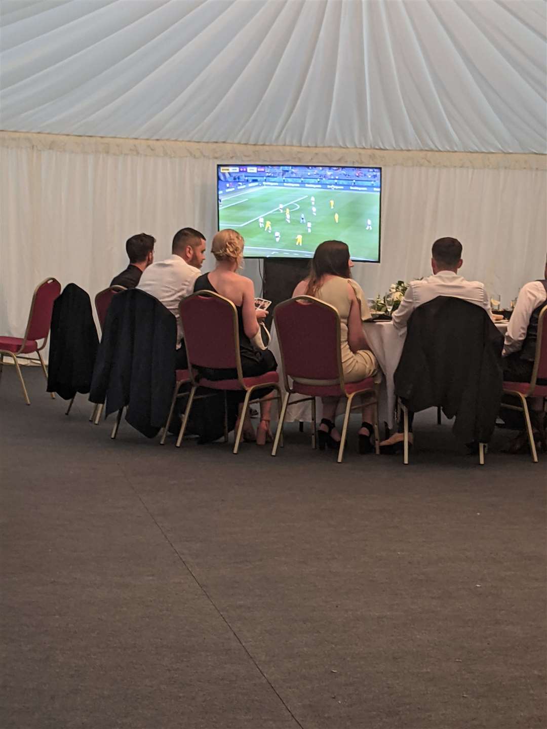 Wedding guests watch the game (48846069)