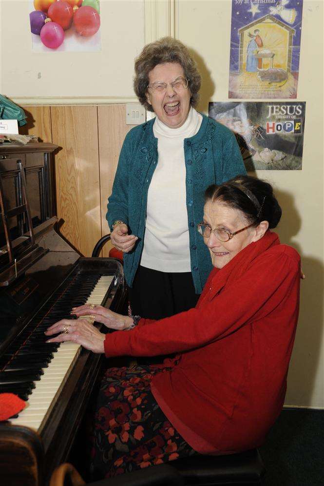 Christine Belsey, who founded Precious Jewels with Marion Montgomery 28 years ago, is picture with stalwart pianist Margaret Barham, who has been playing for families there for 13 years.