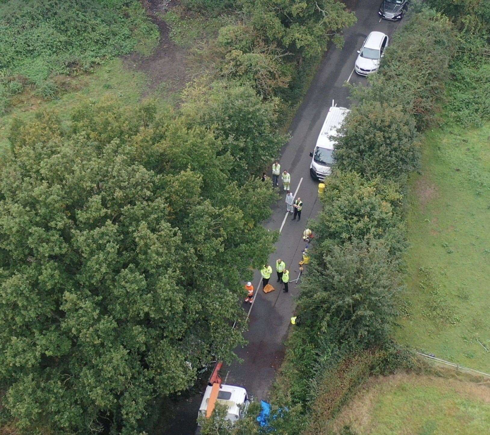 Police attend the scene of a crash in Lenham Road, Headcorn Picture: UKNIP