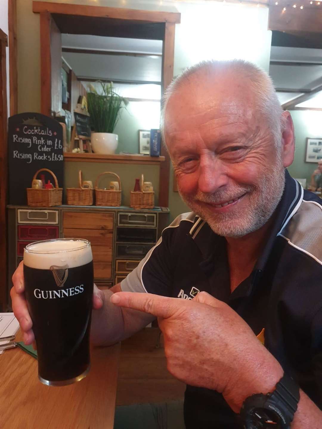 Rick Seirer enjoys his first Guiness after the swim (15941165)