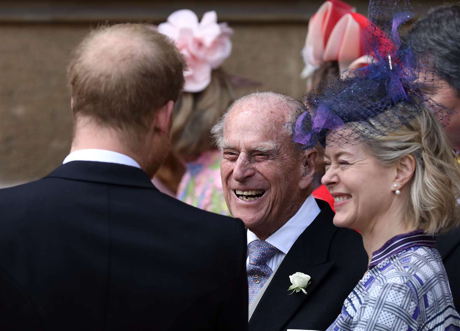The Duke of Edinburgh, in a rare appearance last year, talks to the Duke of Sussex as they leave after the wedding of Lady Gabriella Windsor (Steve Parsons/PA)