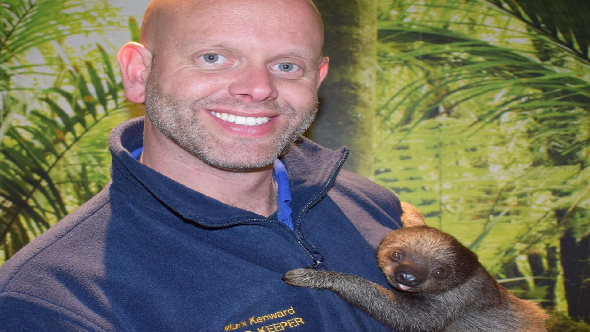 Mark Kenward with Flash the baby sloth