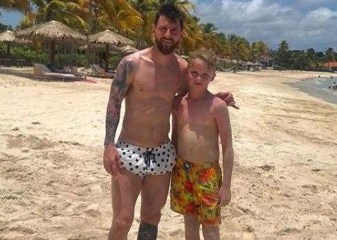 Mackenzie O'Neill with footballing superstar Lionel Messi