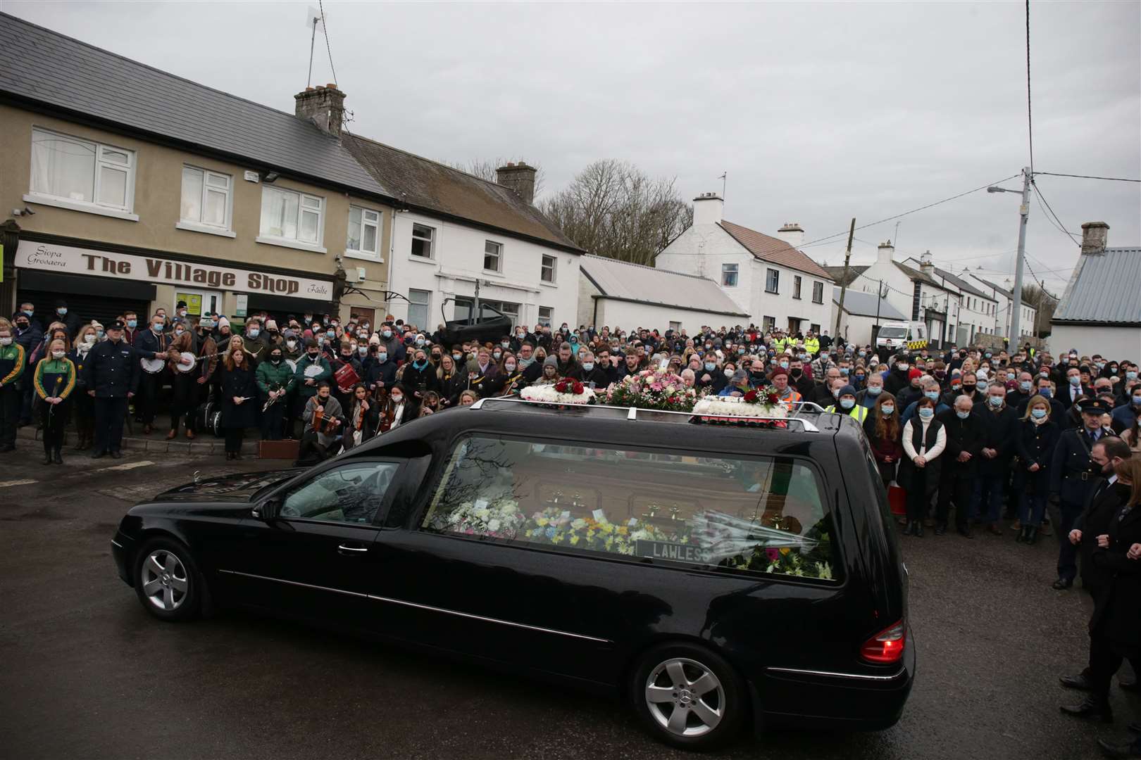 The hearse carrying the coffin leaves St Brigid’s Church, Mountbolus, Co Offaly, at the end of the funeral of Ashling Murphy (Niall Carson/PA)