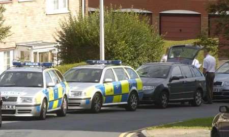 Police officers outside the property on Monday. Picture: BARRY CRAYFORD