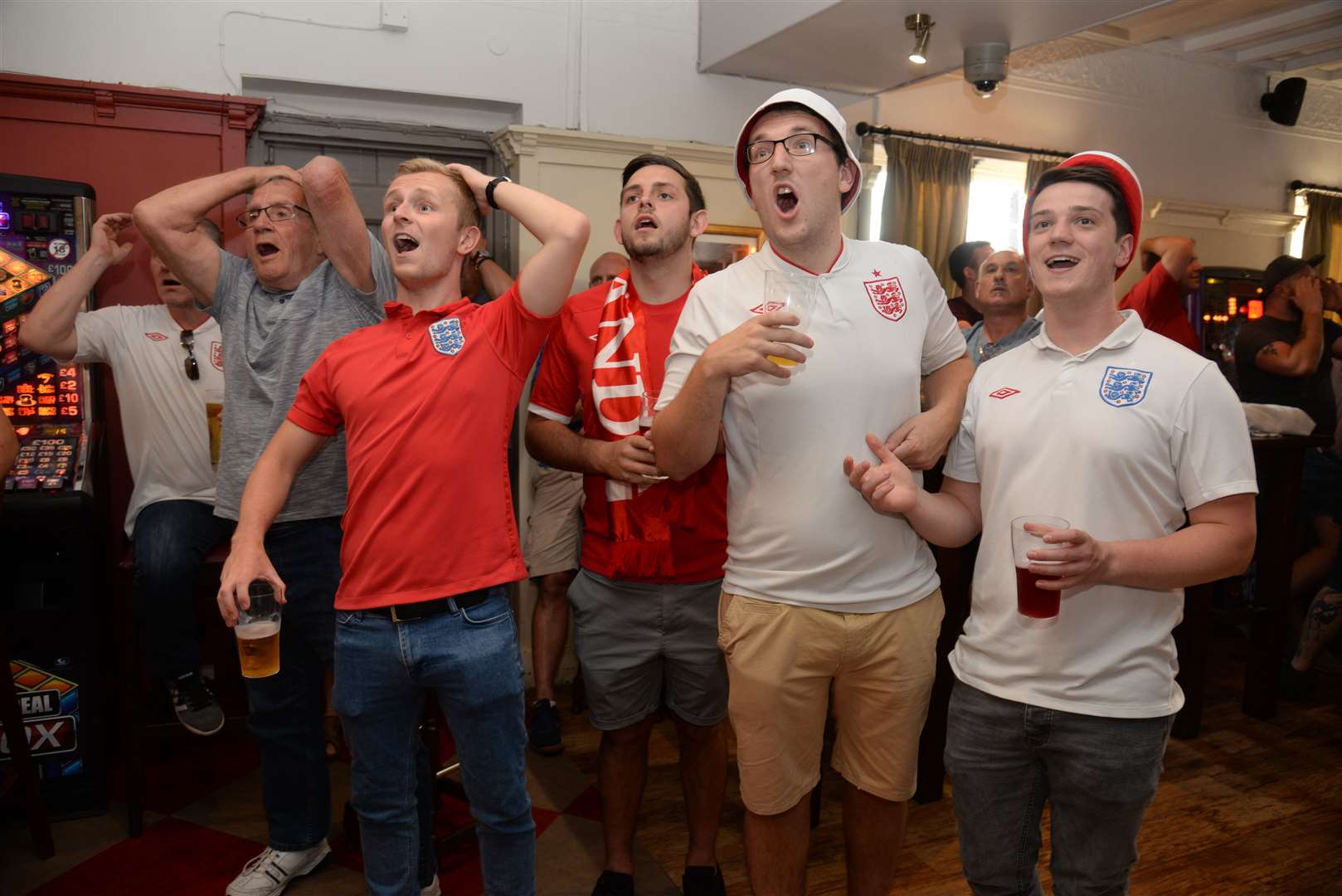 England unexpectedly reached the semi-finals of the 2018 World Cup; these fans are enjoying the game - so far - against Croatia at The Cricketers in Gillingham