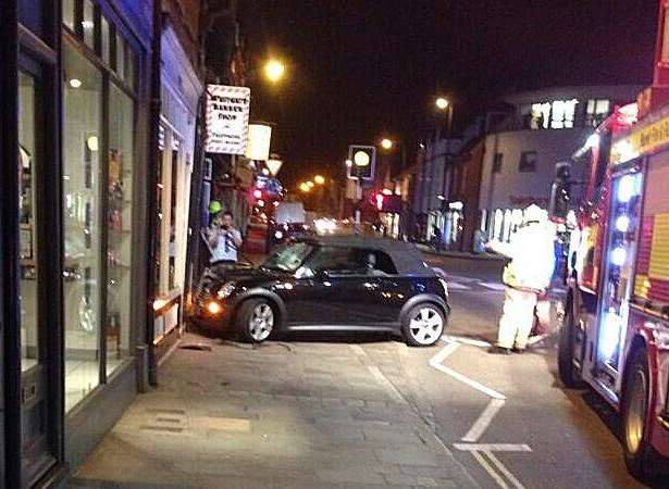 A Mini Cooper crashed into a charity shop in Canterbury. Picture: @pmichaelas