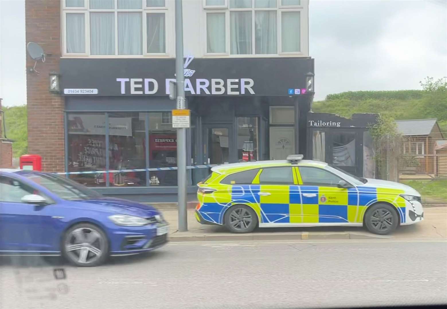 Police car and tape outside Ted Barber, in Strood High Street