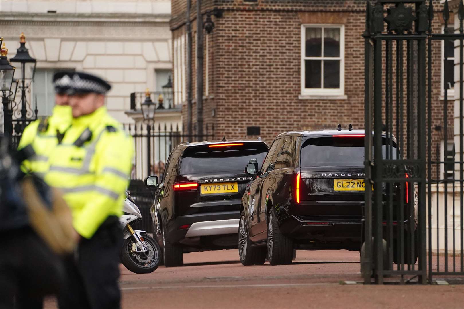 Two black SUVs, one believed to be carrying Prince Harry, arrive at Clarence House (James Manning/PA)