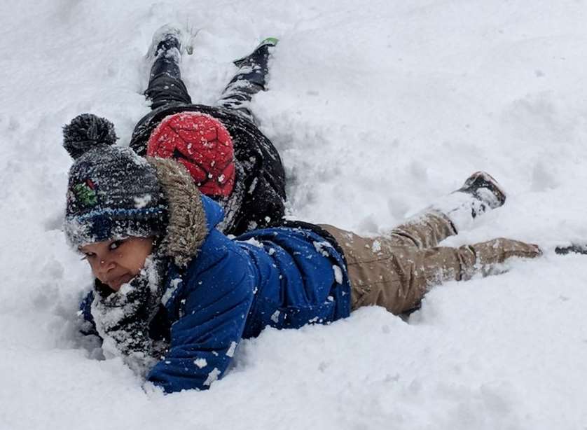 Two boys enjoying the snow in Borstal, Rochester. Picture: @SiDeards