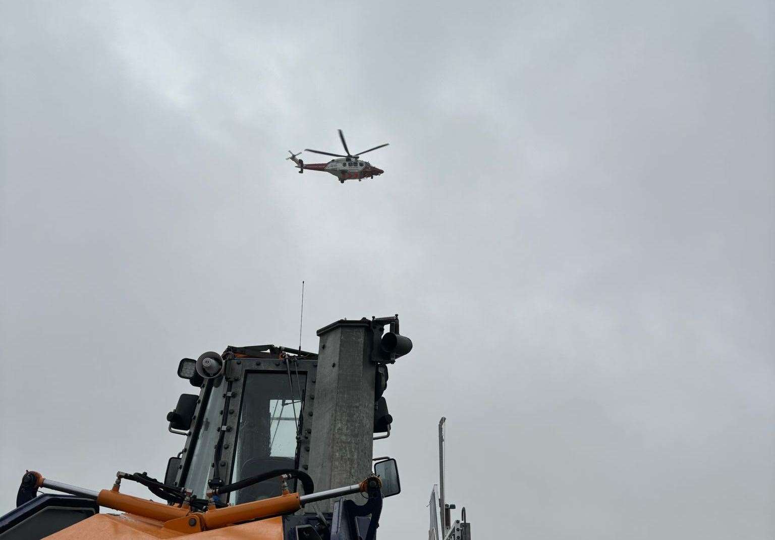 HM Coastguard helicopter overhead Littlestone RNLI station