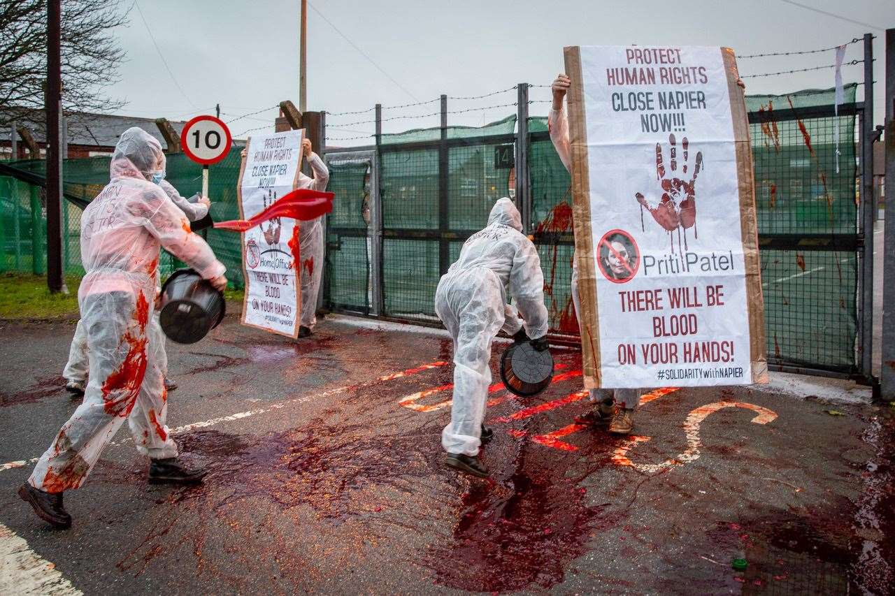 Activists threw fake blood at the gates during one protest. Photo: Andrew Aitchison