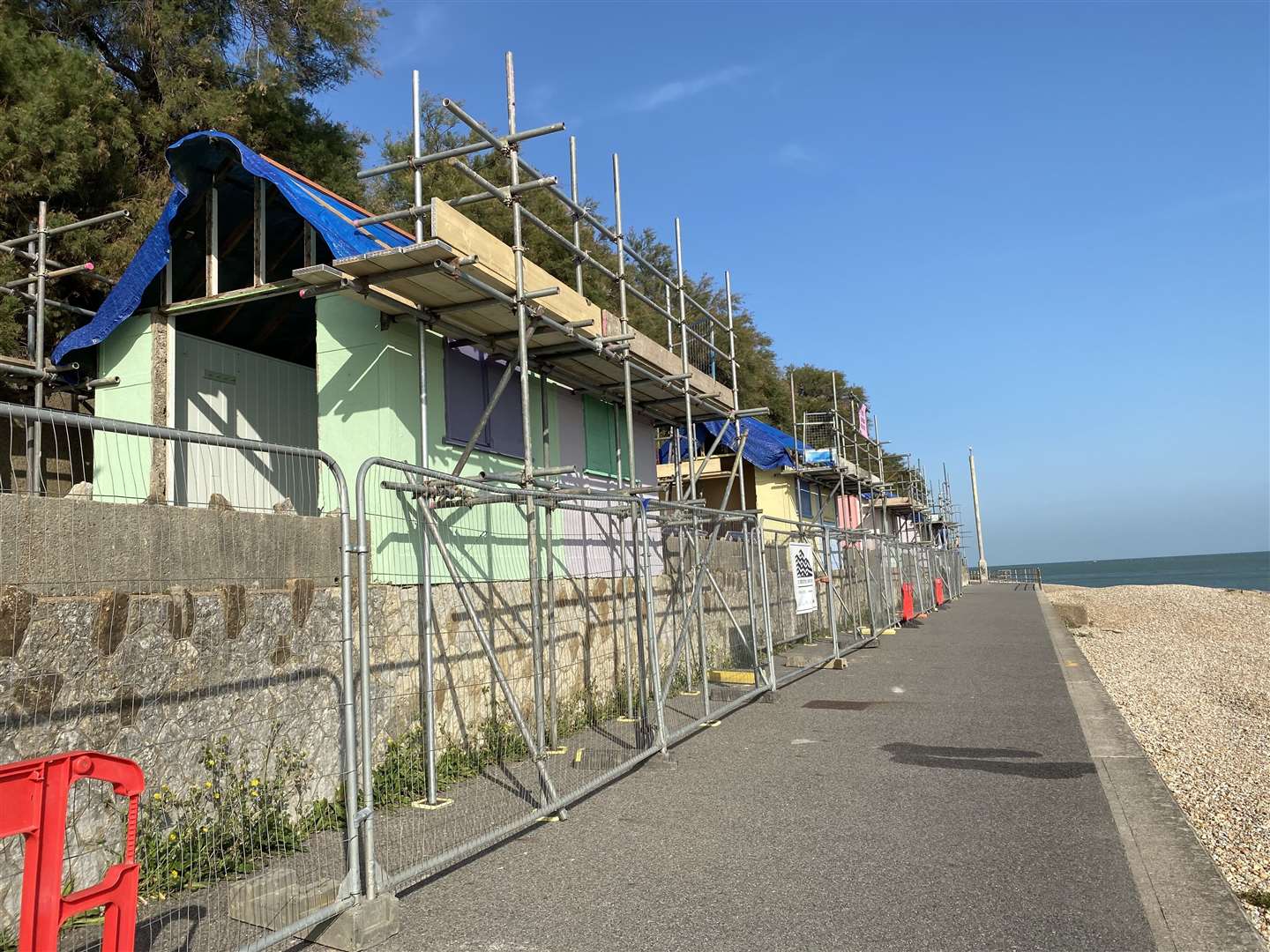 Work is taking place to repair and replace some of the beach huts between Folkestone and Sandgate. Some have already been torn down. Some are being worked on. In addition, wooden huts will be added to the promenade. Some of the existing huts have fallen into disrepair over the years. (42344778)