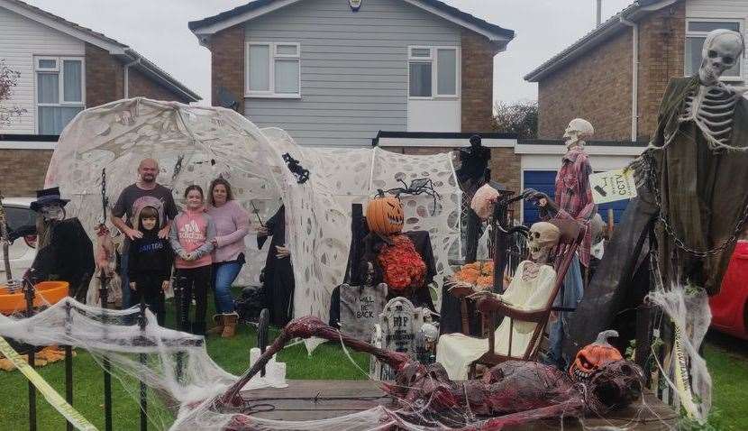The Ameys have transformed their front garden into a ghoulish graveyard to raise money for charity this Halloween