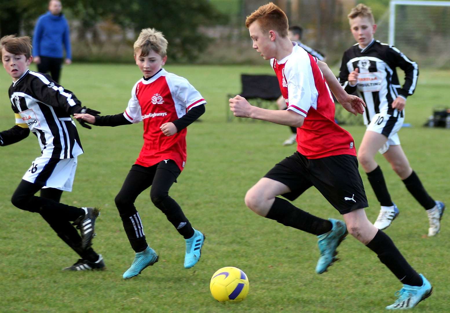 Omega 92 under-13s (red) on the charge against Milton & Fulston United under-13s. Picture: Phil Lee FM21312795