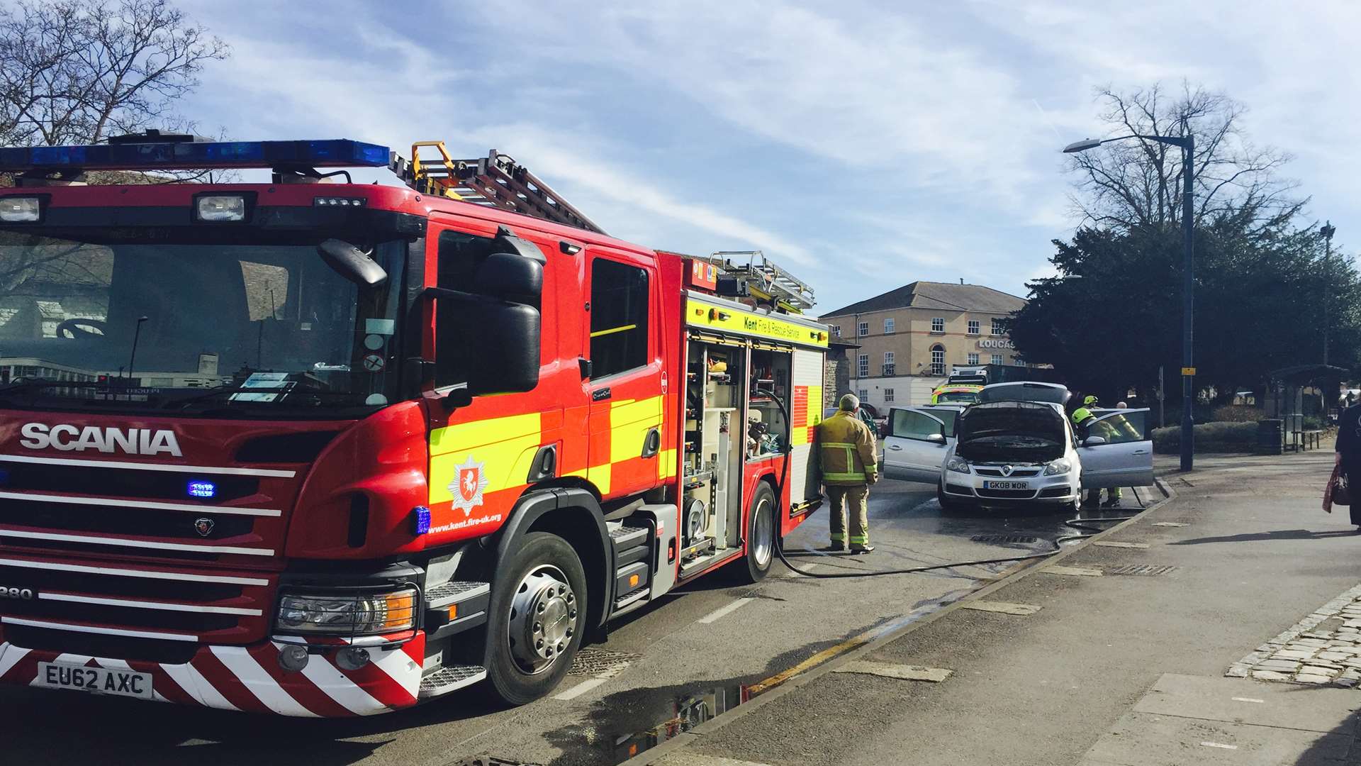 Crews tackle a car fire outside the Archbishop's Palace in Maidstone.