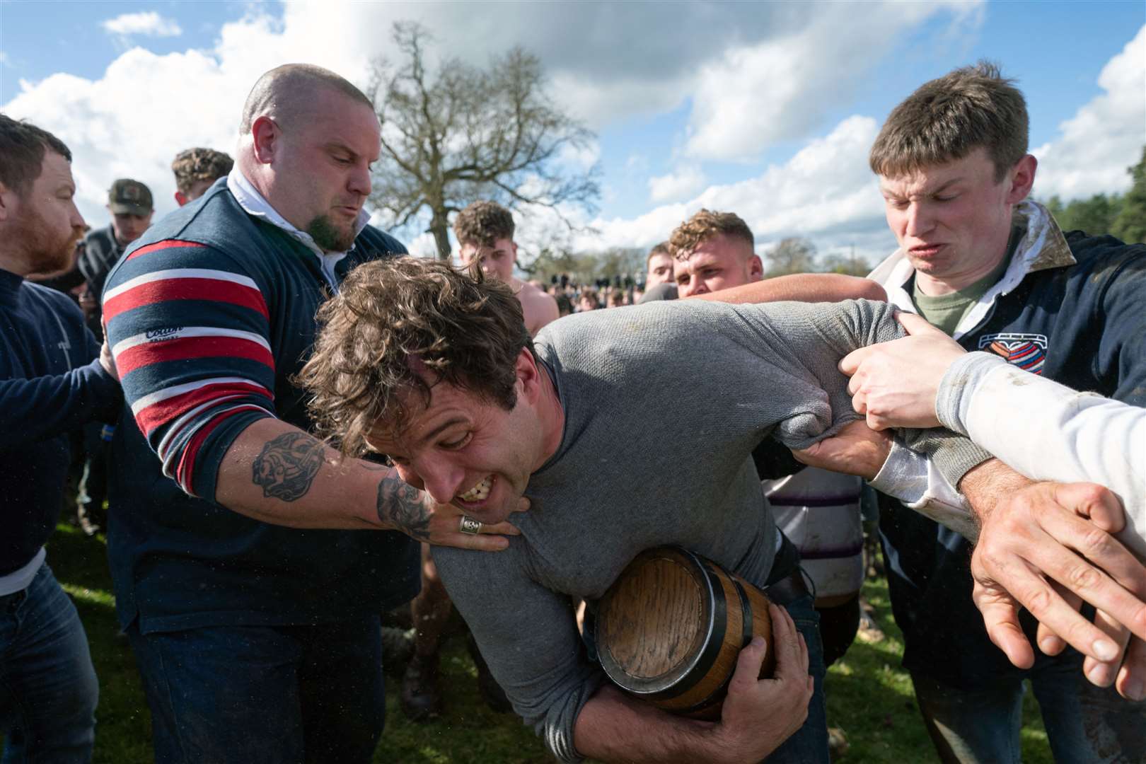 Players from the villages of Hallaton and Medbourne battle for the ‘bottle’, an old field barrel holding about a gallon of beer, during the annual game of bottle-kicking in Leicestershire in April (PA)