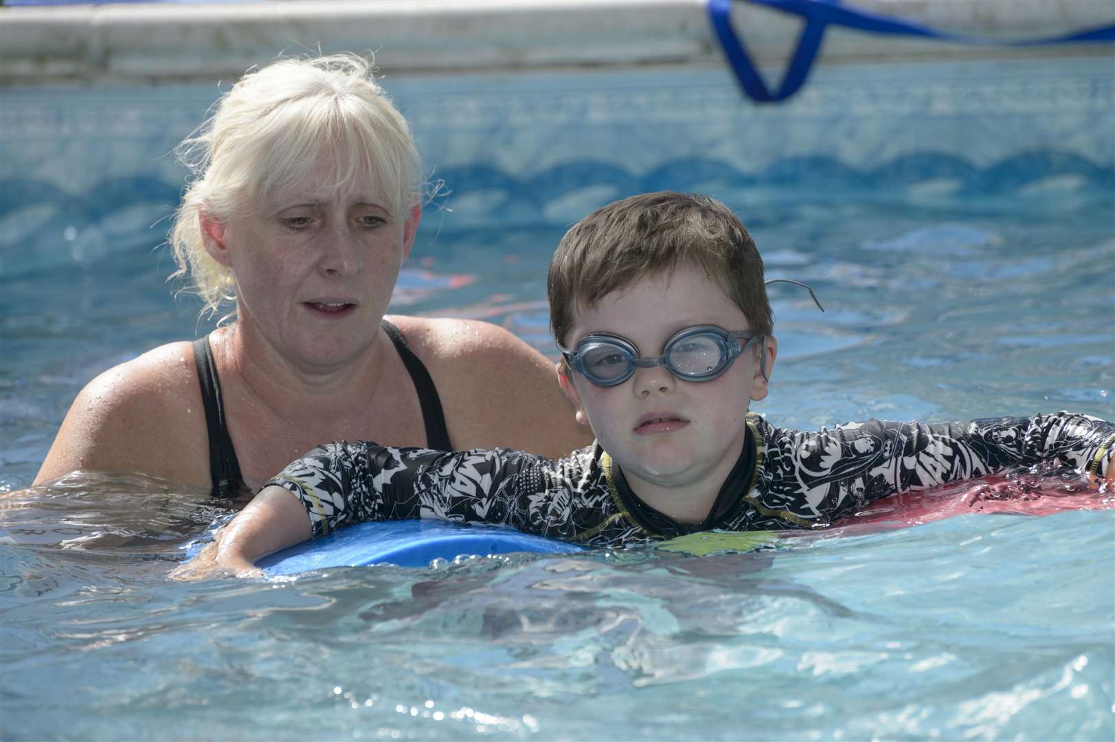Denise Calvert, with pupil Aidan, 4. The DC Swim School, run by Denise Calvert at New Barn Road, Longfield, is facing closure after Dartford Council decided planning permission was needed after nine years of the school (and the pool itself being older still). .Picture: Andy Payton. (2746921)