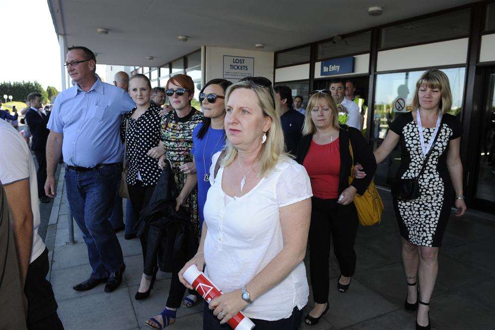 Workers leave the terminal building for the last time. Picture: Tony Flashman