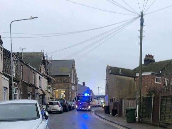 Fire crews are helping evacuate people from homes and businesses in North Road, Queenborough. Picture: Kelly Clymer