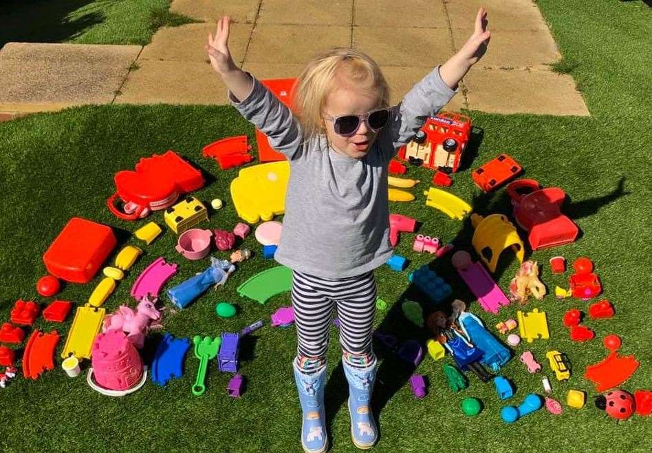 Sophia with her toy rainbow
