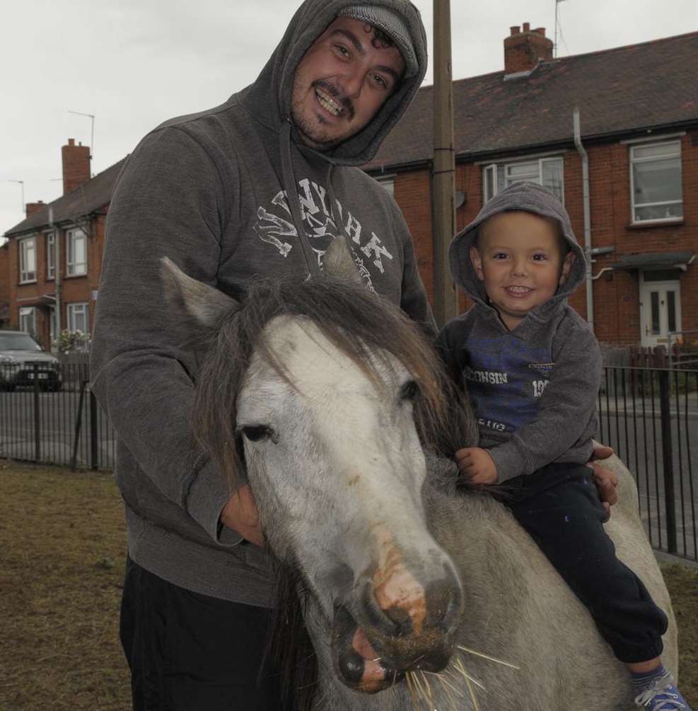 Aaron Trotter and his son Mason, two, on their horse