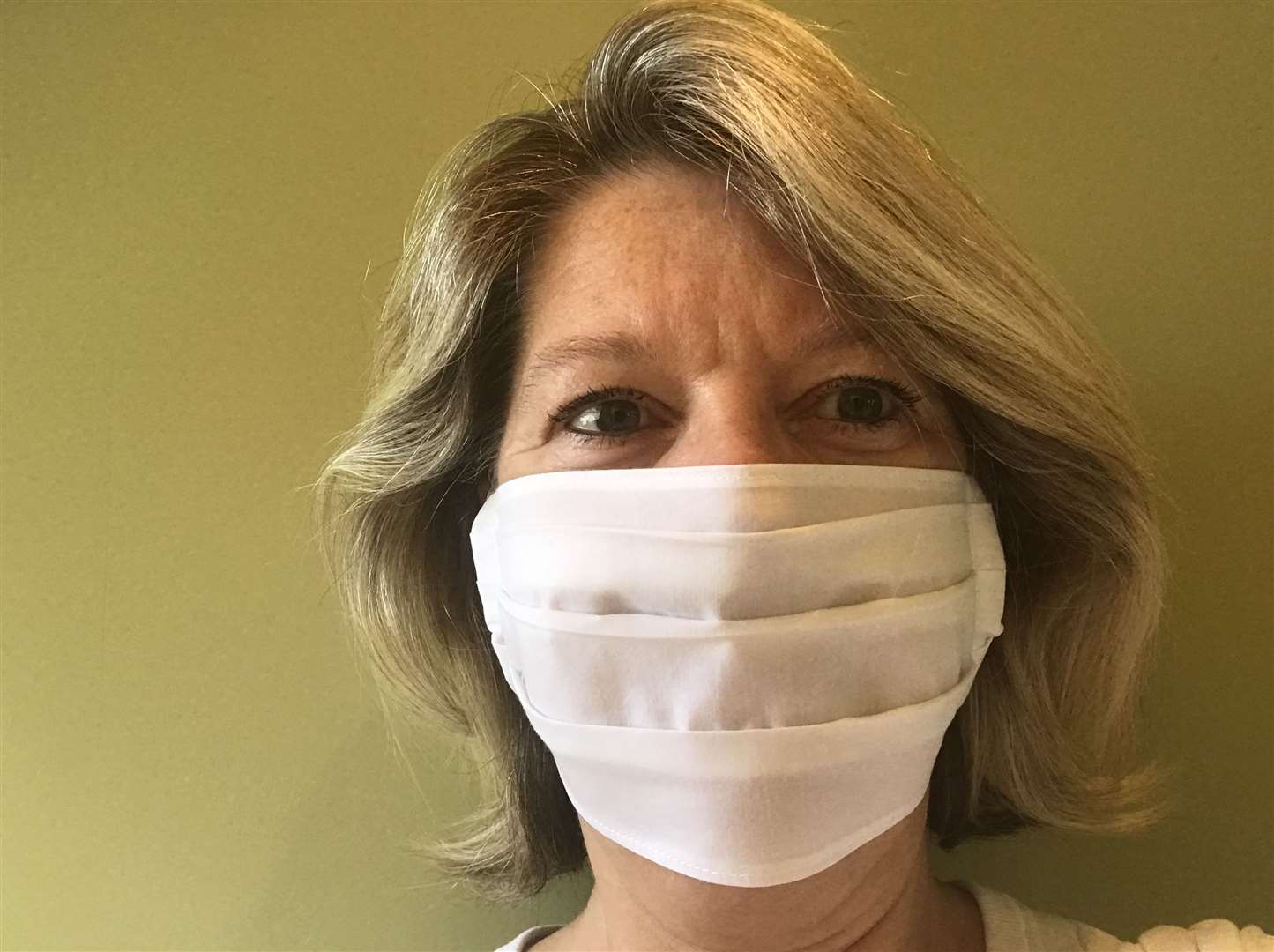 Jane Grier, from The Hayesbrook School, wearing a material face mask she has made for health and care workers